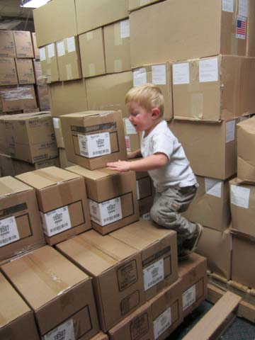 grandson climbing boxes - ha!